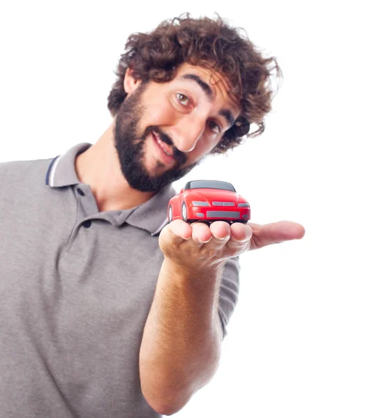 Young crazy man with a car toy — Stock Photo, Image