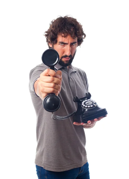 Jovem louco oferecendo um telefone — Fotografia de Stock