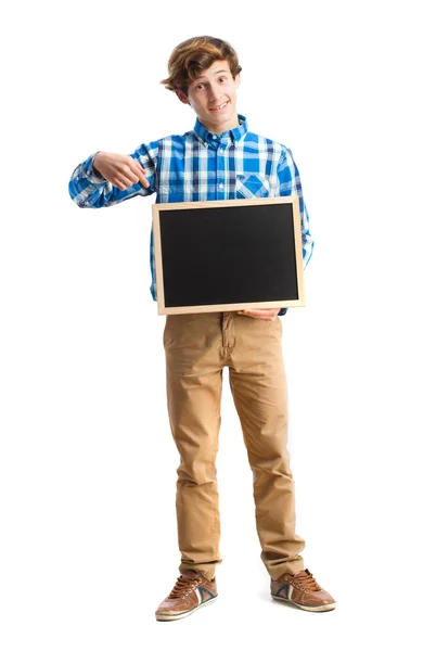 Adolescente sosteniendo una pizarra — Foto de Stock