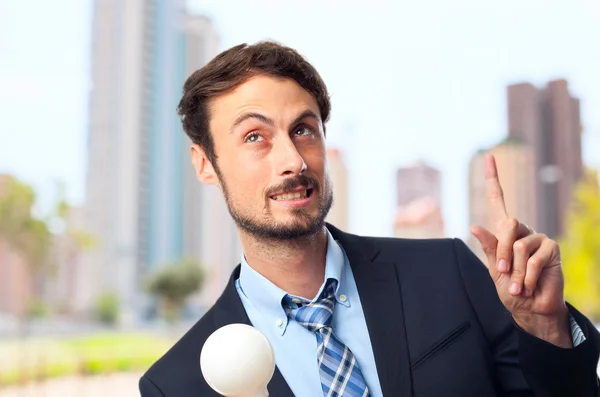 Young crazy businessman having an idea — Stock Photo, Image