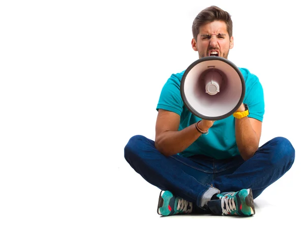 Cara gritando com um megafone — Fotografia de Stock