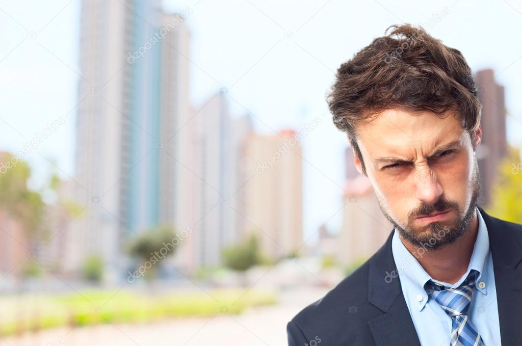 young crazy businessman angry face