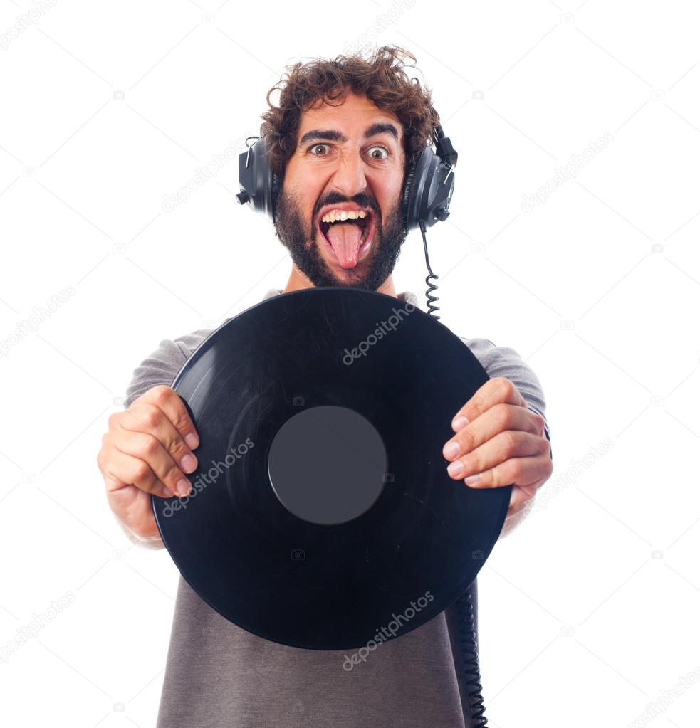 young bearded man with headphones and disk