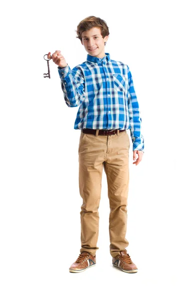 Teenager holding a key — Stock Photo, Image