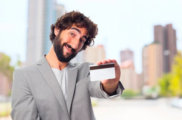 Young crazy man with a credit card — Stock Photo, Image