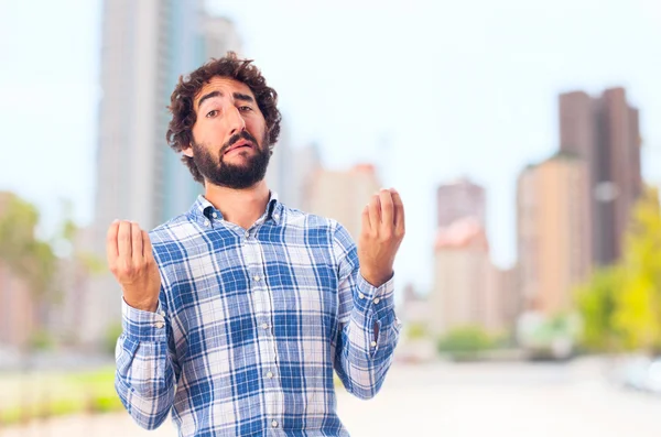 Young man incomprehension — Stock Photo, Image