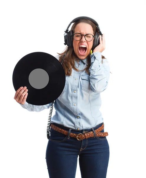 Young woman with headphones holding a vinyl — Stock Photo, Image