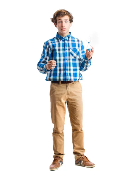 Teenager holding a hourglass — Stock Photo, Image