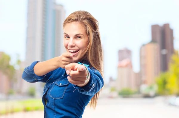 Young cool woman pointing — Stock Photo, Image