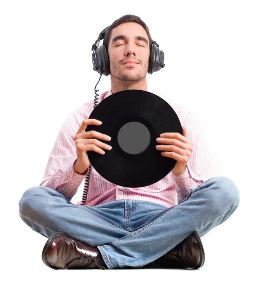 Hombre con auriculares y vinilo — Foto de Stock