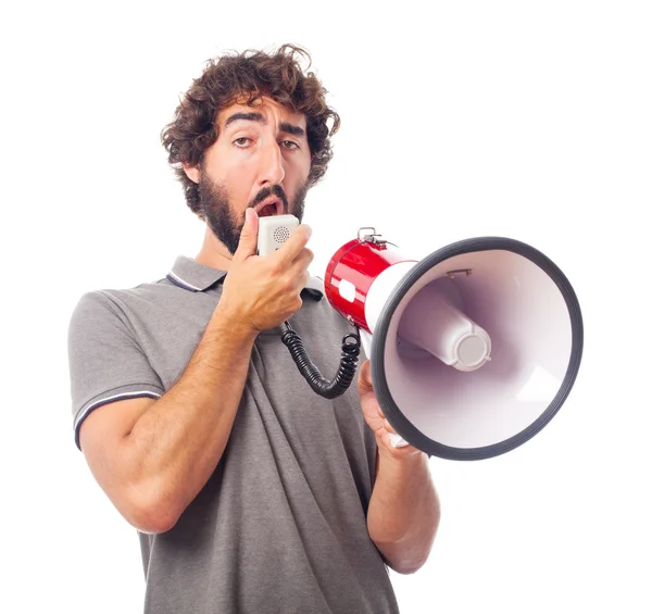 Jovem louco homem suberb com um megafone — Fotografia de Stock