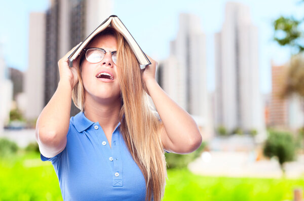 young cool woman boring with a book