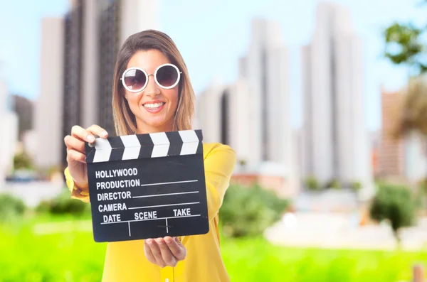 Young cool woman with clapperboard — Stock Photo, Image
