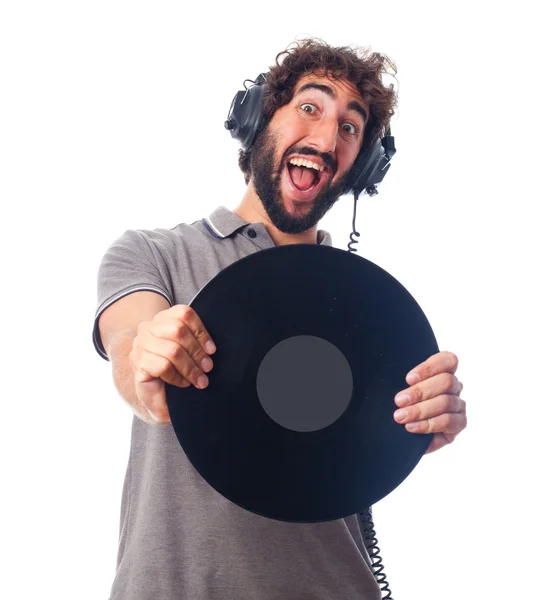 Joven barbudo con auriculares y disco — Foto de Stock