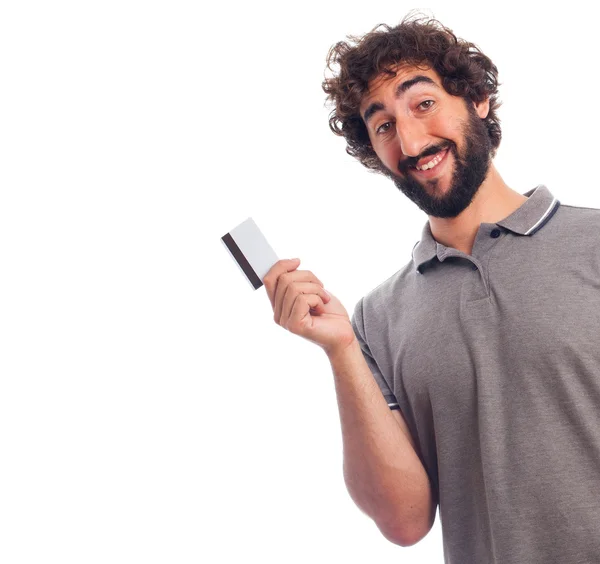 Jovem barbudo com um cartão de crédito — Fotografia de Stock