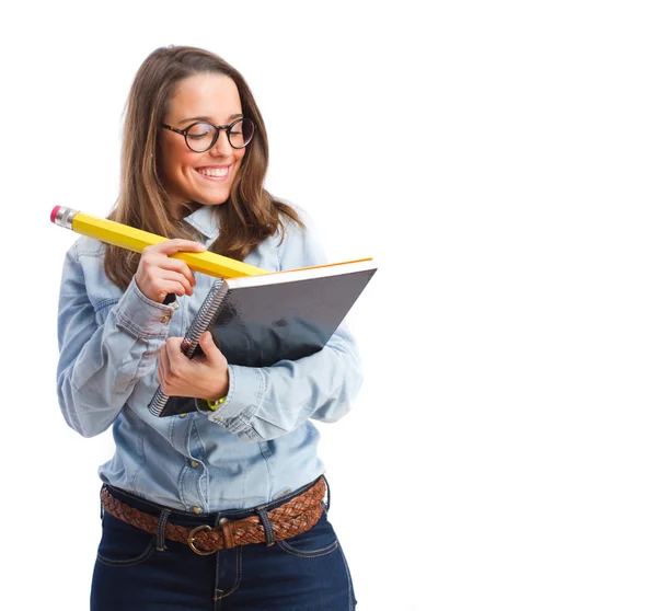 Jovem mulher escrevendo em um caderno — Fotografia de Stock