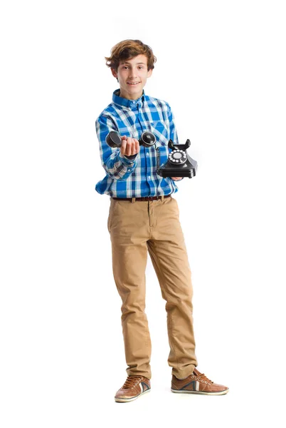 Teenager showing a telephone — Stock Photo, Image