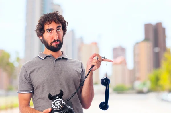 Young crazy man boring at phone — Stock Photo, Image