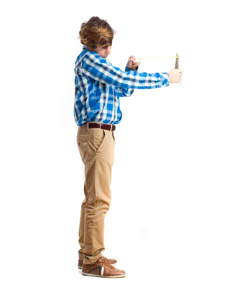 Teenager holding a slingshot — Stock Photo, Image