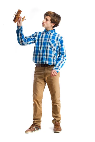 Teenager playing with wood plane — Stock Photo, Image