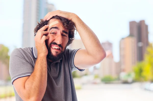 Young crazy man with head pain — Stock Photo, Image