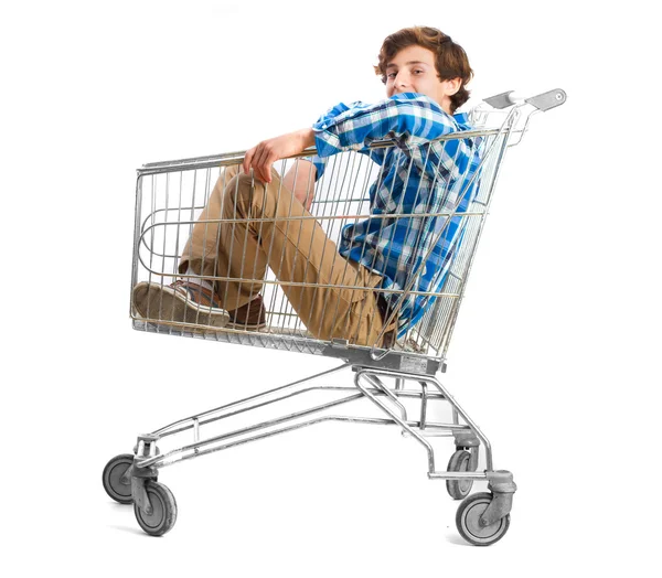 Teenager inside a shopping cart — Stock Photo, Image