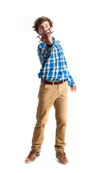 Teenager playing with wood plane — Stock Photo, Image