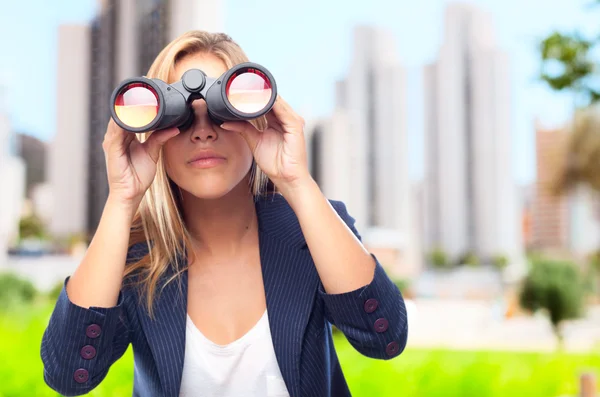 Young cool woman with binoculars — Stock Photo, Image