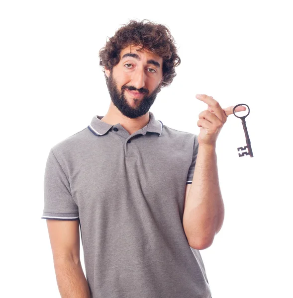 Young crazy man with an old key — Stock Photo, Image