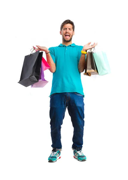 Teenager holding a shopping bags — Stock Photo, Image