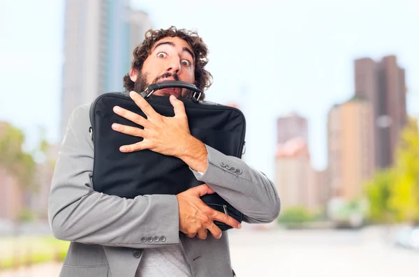 Young crazy man with a suitcase — Stock Photo, Image