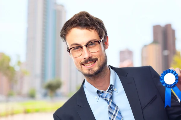 Young crazy businessman with a medal — Stock Photo, Image