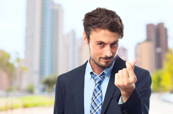 Young crazy businessman money gesture — Stock Photo, Image