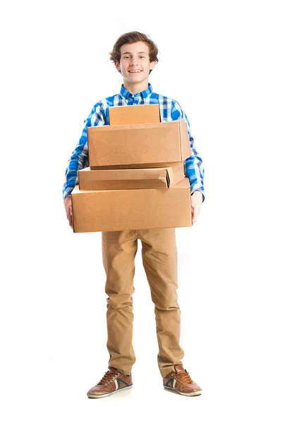 Teenager holding a cardboard boxes — Stock Photo, Image