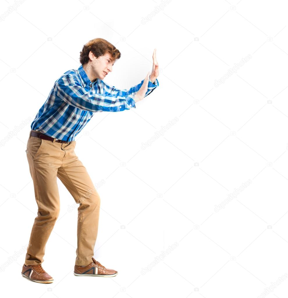Joven chico empujando gesto — Foto de stock #65271241 © kues, image size:990x1024
