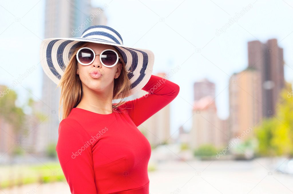 young cool woman with sunglasses an hut