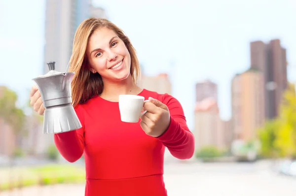 Young cool woman with cup and a kettle — Stock Photo, Image