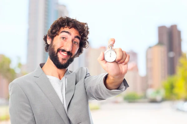 Bir kronometre ile genç deli adam — Stok fotoğraf