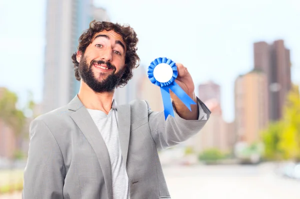 Young crazy man with a medal — Stock Photo, Image