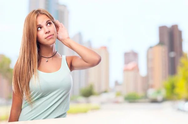 Joven cool mujer tratando de escuchar —  Fotos de Stock