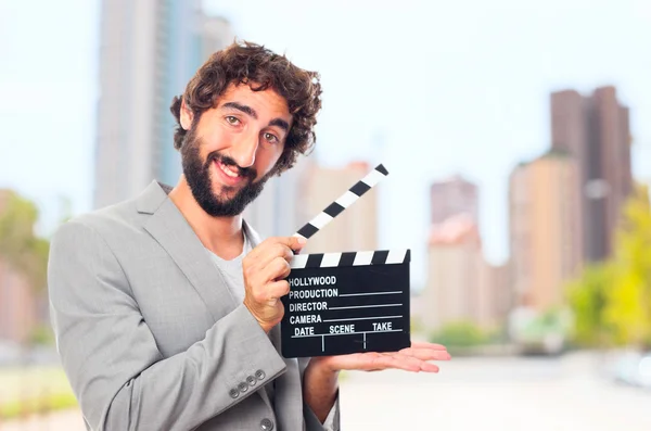 Young crazy manwith a clapperboard — Stock Photo, Image