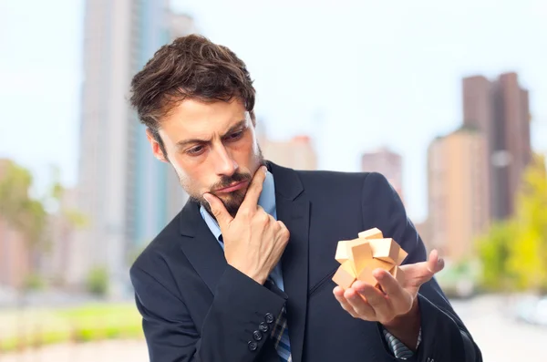 Junger verrückter Geschäftsmann vor einer Herausforderung — Stockfoto