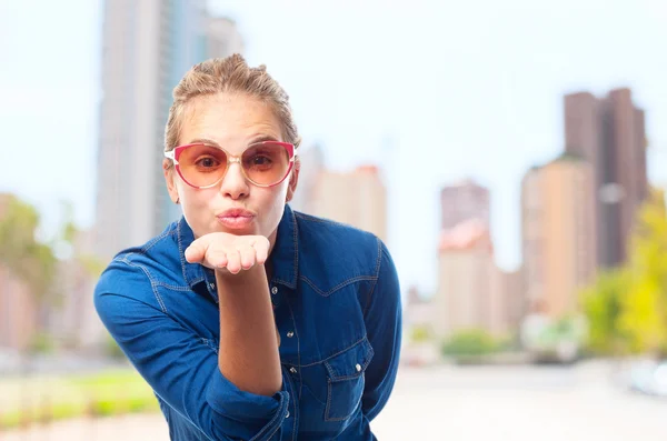 Young cool woman sending a kiss — Stock Photo, Image