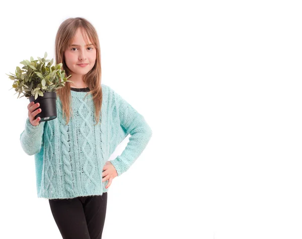 Νεαρό κορίτσι με ένα φυτό — Φωτογραφία Αρχείου