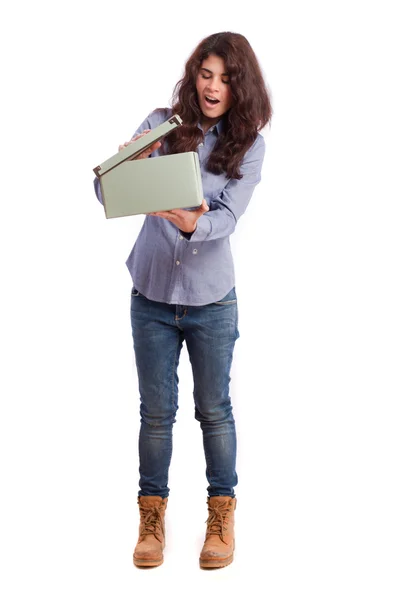 Astonished girl opening a box — Stock Photo, Image