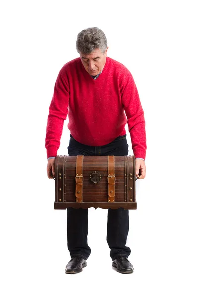 Man holding a weighty trunk — Stock Photo, Image