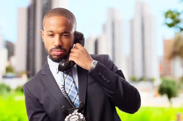 Young cool black man boring at phone — Stock Photo, Image