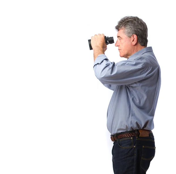 Hombre sosteniendo un prismáticos — Foto de Stock