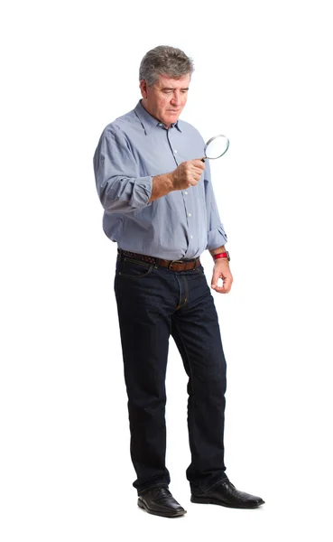 Man holding a magnifying glass — Stock Photo, Image