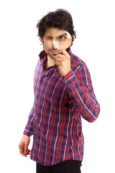 Hindu young man with a magnitying glass — Stock Photo, Image